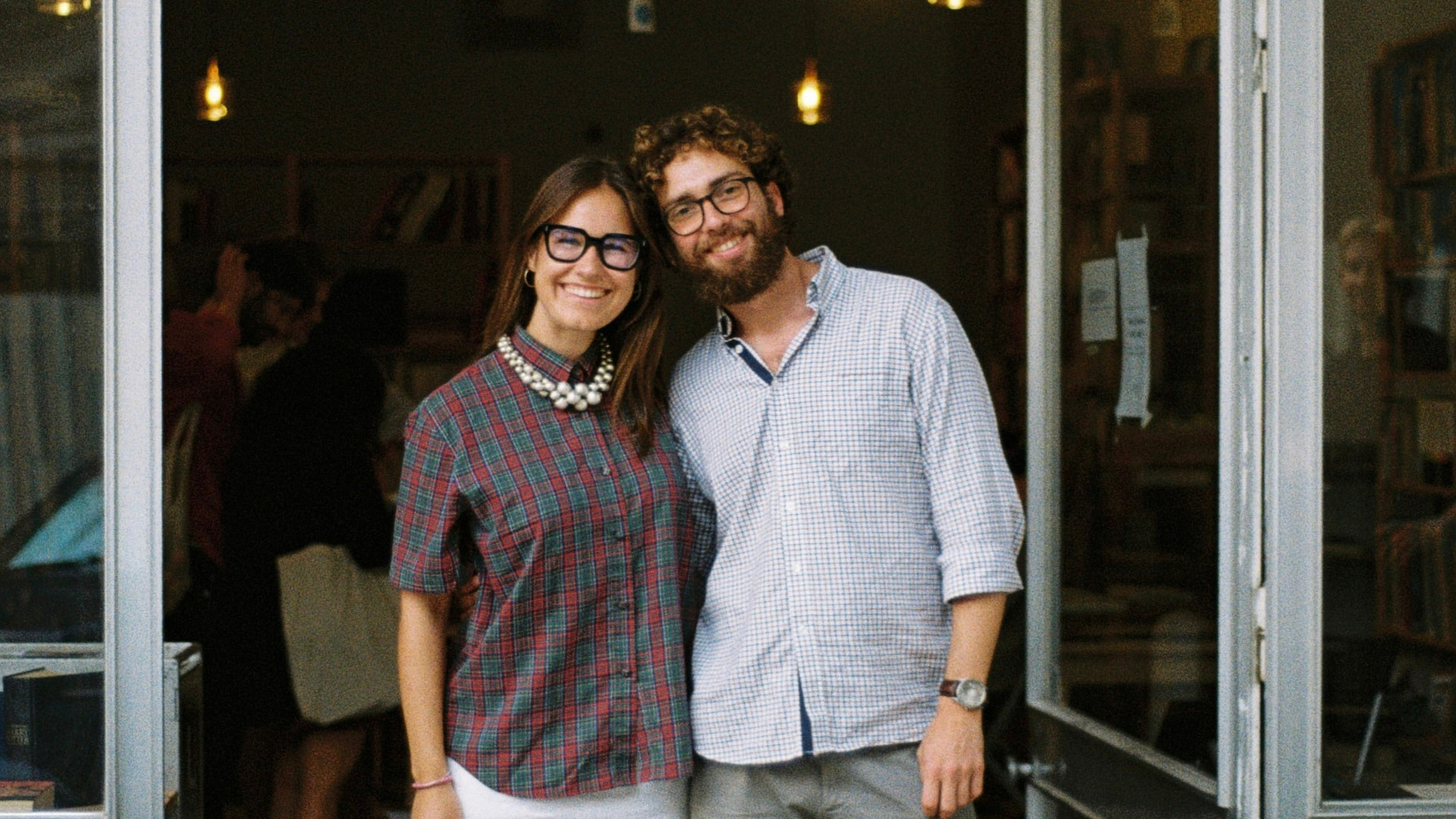 Elisabeth, 2Pages Founder, and Rui, Stuffout Bookstore Owner, standing in the bookstore entrance