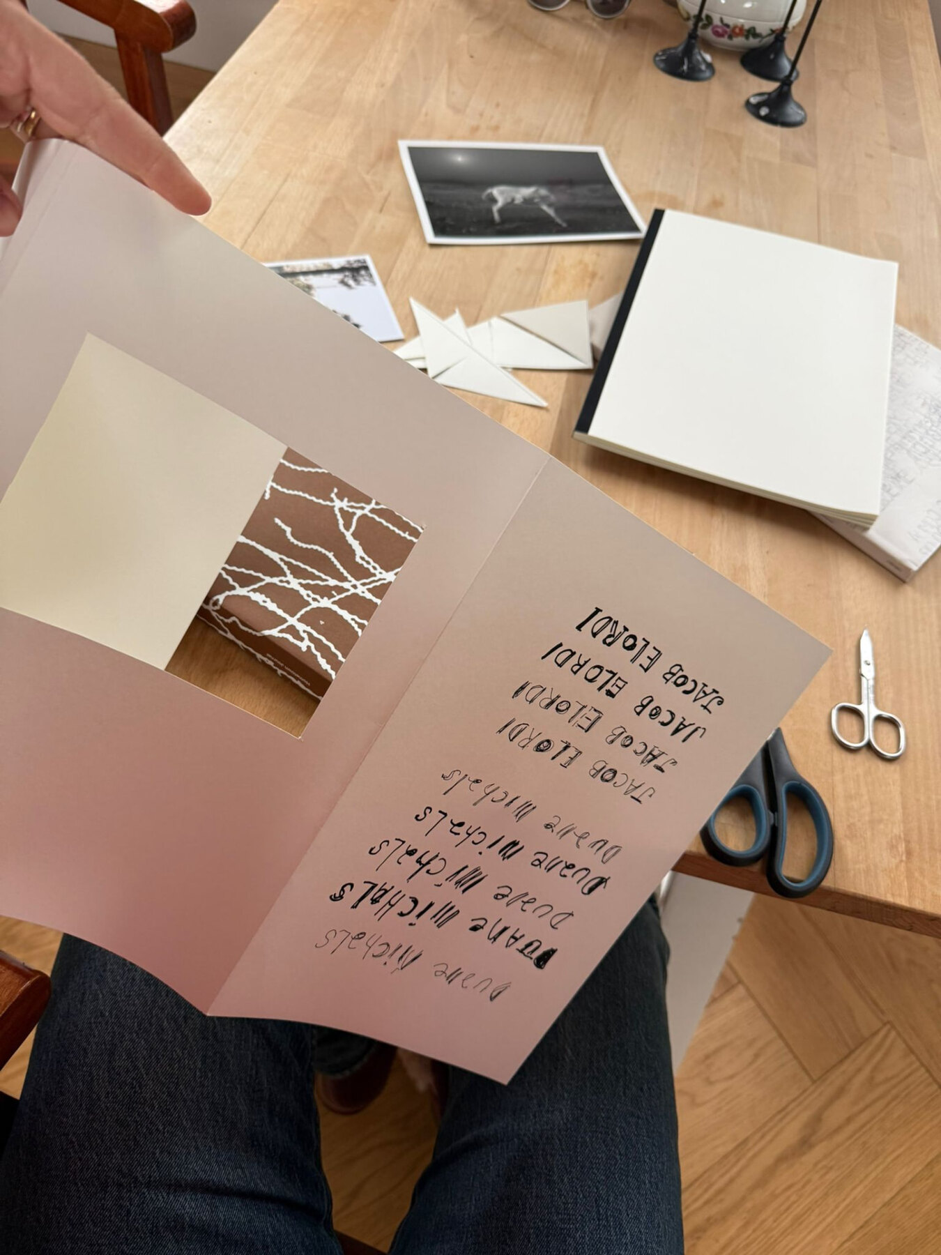 Pages being folded and cut by hand while experimenting with the first 2Pages layout