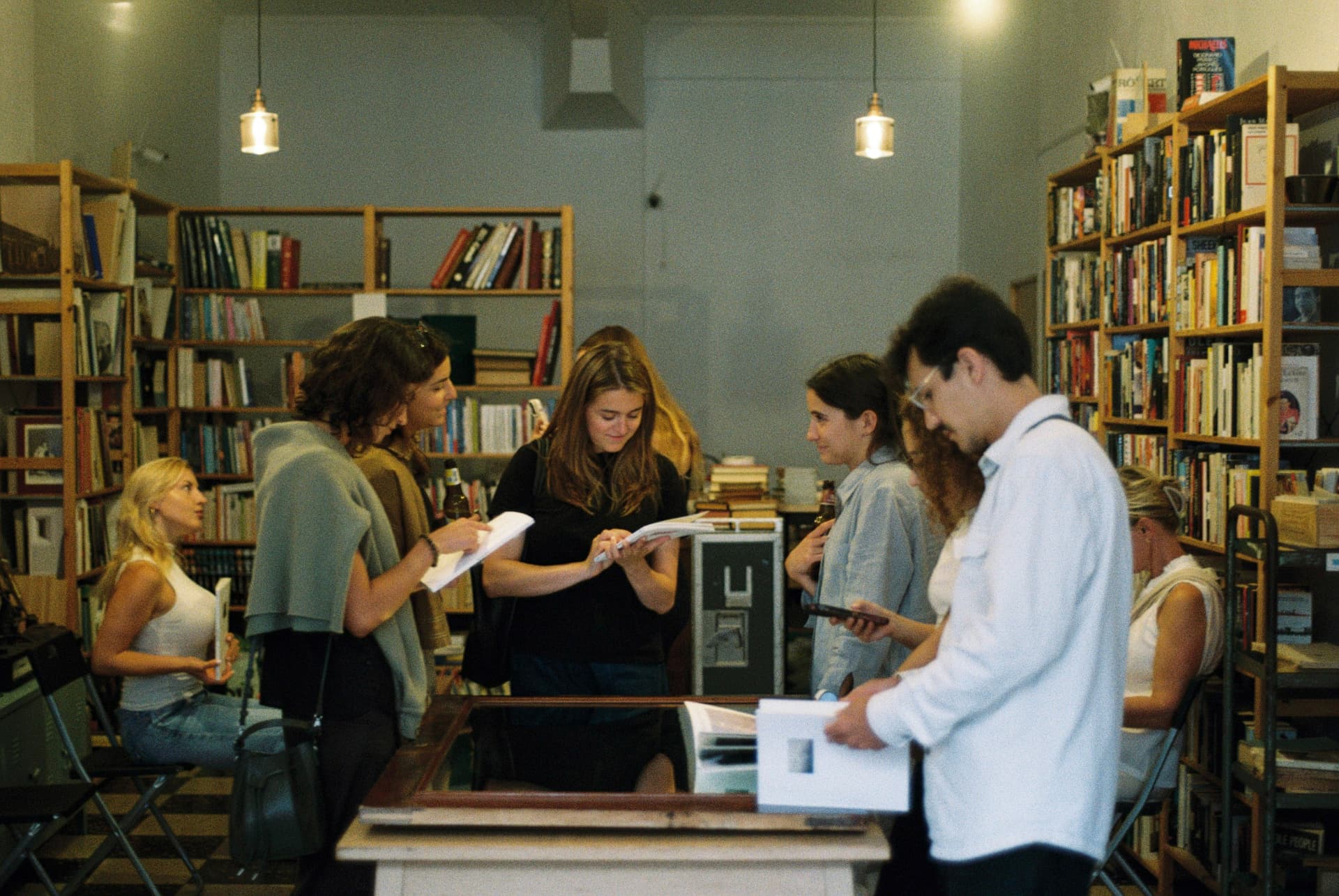 Visitors reading inside Stuffout Bookstore during the 2Pages Issue 01 launch