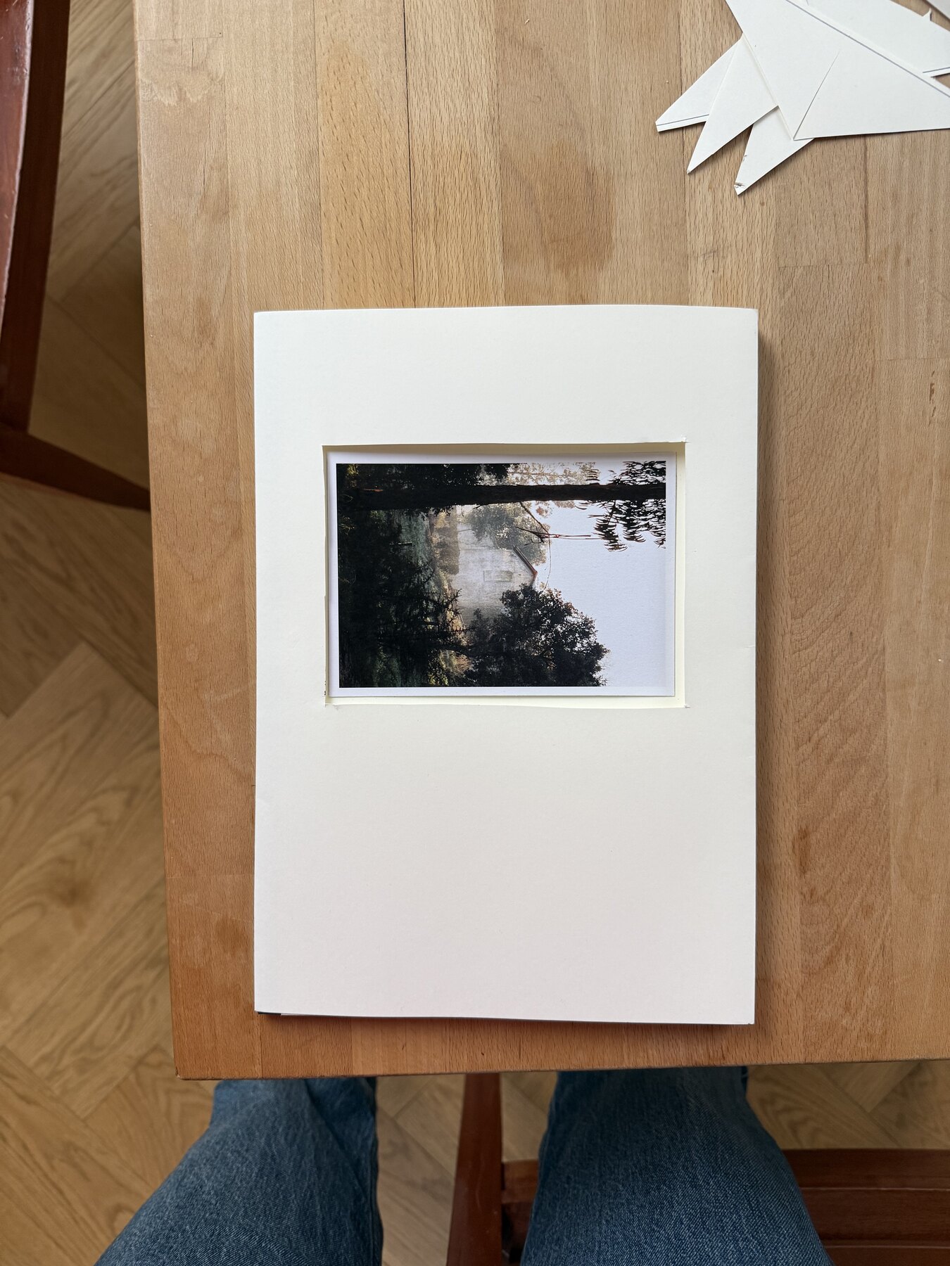 A hand-made 2Pages cover prototype lying on a wooden table